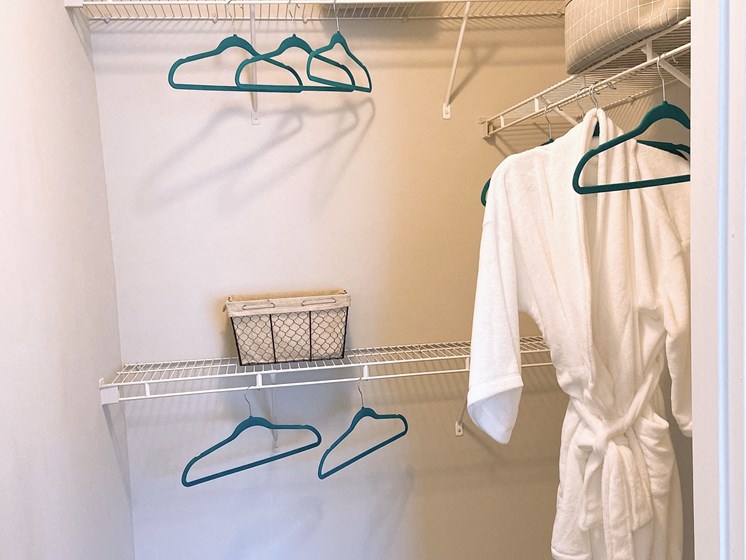 walk-in closet with shelves and bathrobe in an apartment in Fayetteville